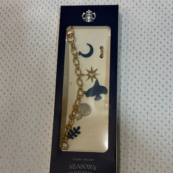 Starbucks Accessories - Starbucks Cream Bag Charm with Gold Chain and Blue Charms